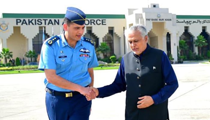 DPM Ishaq Dar is greeted by a PAF officer at the Nur Khan Air Base in rawalpindi before his departure on May 19, 2025. — X@ForeignOfficePK