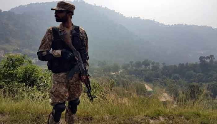 A Pakistani soldier stands guard in a village located near the Line of Control (LoC). — AFP/File