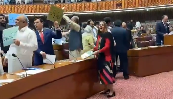 Opposition Leader in the National Assembly Omar Ayub Khan (second from right) along with PTI lawmakers protesting in the National Assembly during the budget session on June 10, 2025. — Screengrab via X/@PTIofficial